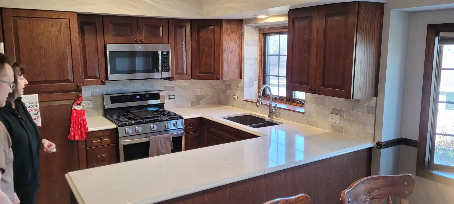 after kitchen remodel, dark cabinets, white countertops