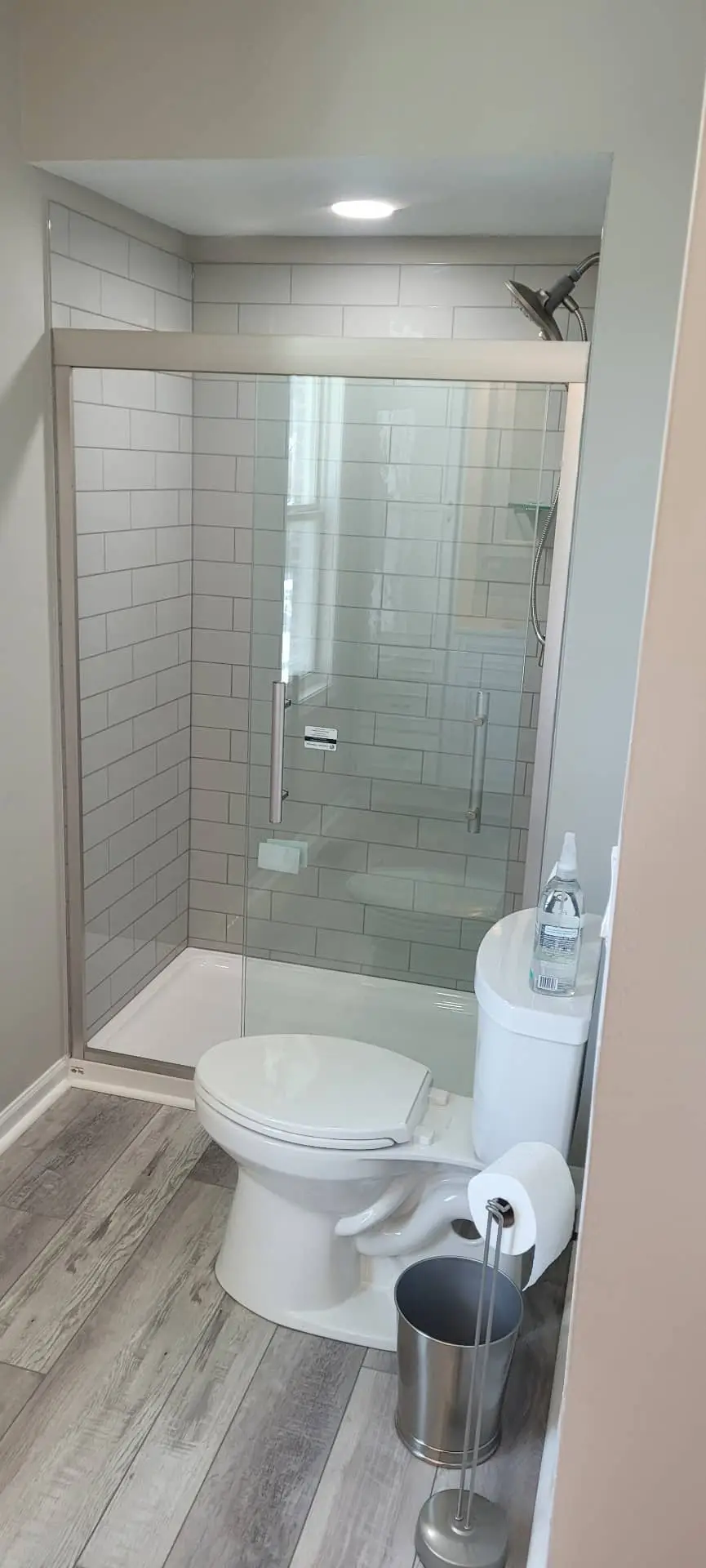 grey and white bathroom, walk in shower, tiled, glass door